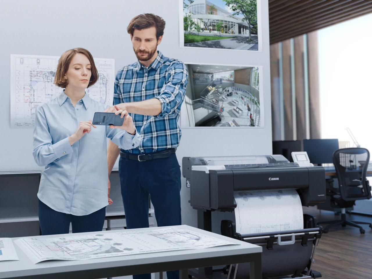 Canon imagePROGRAF TM-5510M alongside printed CAD drawings